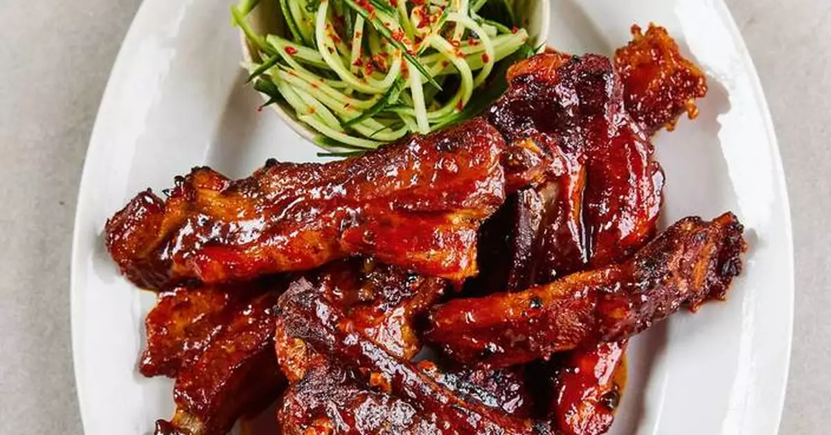 Slow-cooked, sticky-glazed pork ribs go with cucumber slaw in Sam Way's recipe