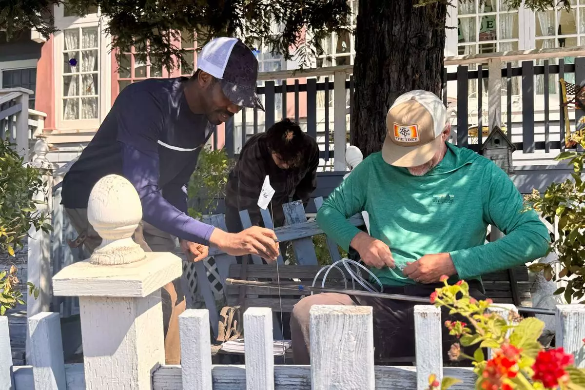 Scientists take samples from the soil Thursday, May 7, 2026, from the front yard of a home in Arroyo Grande, Calif., connected to the man convicted of killing Kristin Smart as part of a sheriff's investigation. (AP Photo/Haven Daley) CORRECTION: Corrects from authorities to scientists