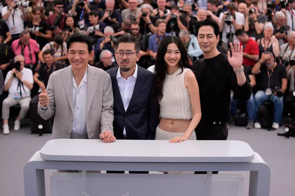 Hwang Jung-min, from left, director Na Hong-jin, Hoyeon and Zo In-sung pose for photographers at the photo call for the film 'Hope' during the 79th international film festival, Cannes, southern France, Monday, May 18, 2026. (AP Photo/John Locher)