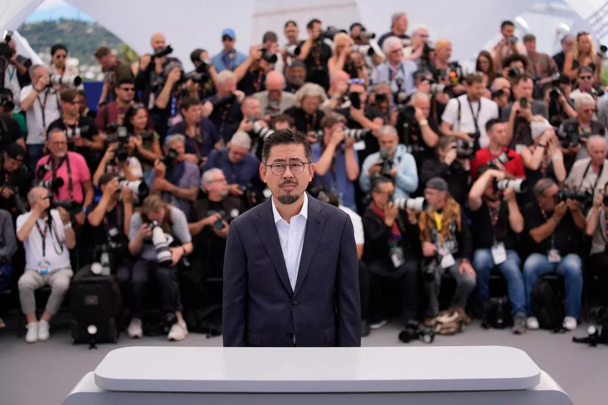 Director Na Hong-jin poses for photographers at the photo call for the film 'Hope' during the 79th international film festival, Cannes, southern France, Monday, May 18, 2026. (AP Photo/John Locher)