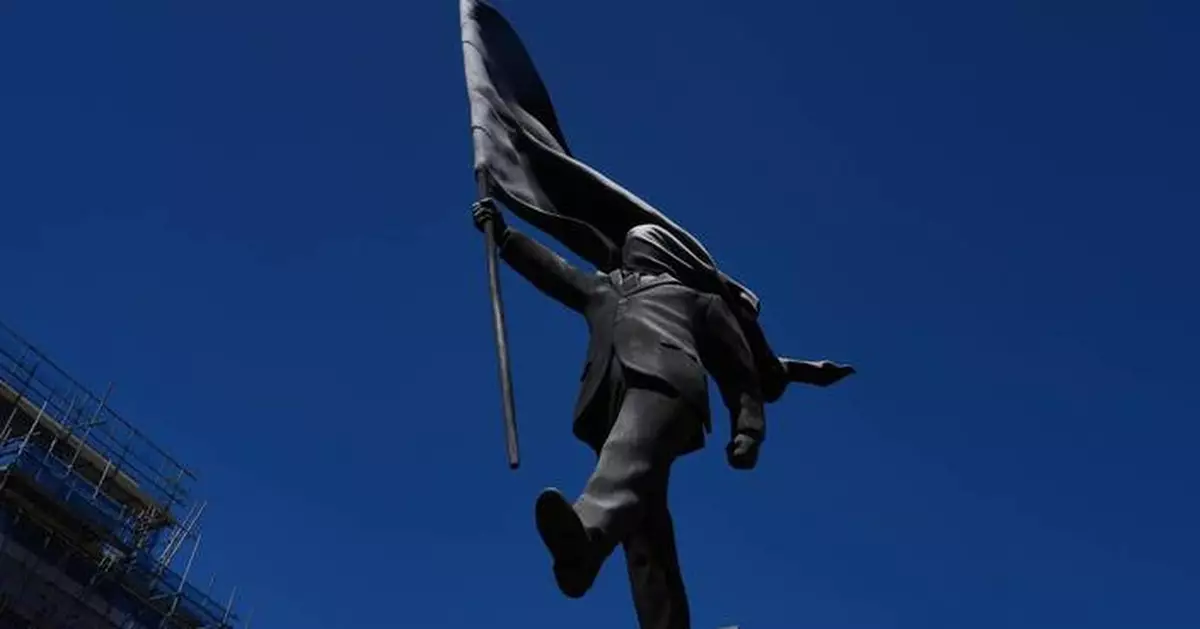 Banksy confirms a new statue in central London of a man blinded by a flag is his work