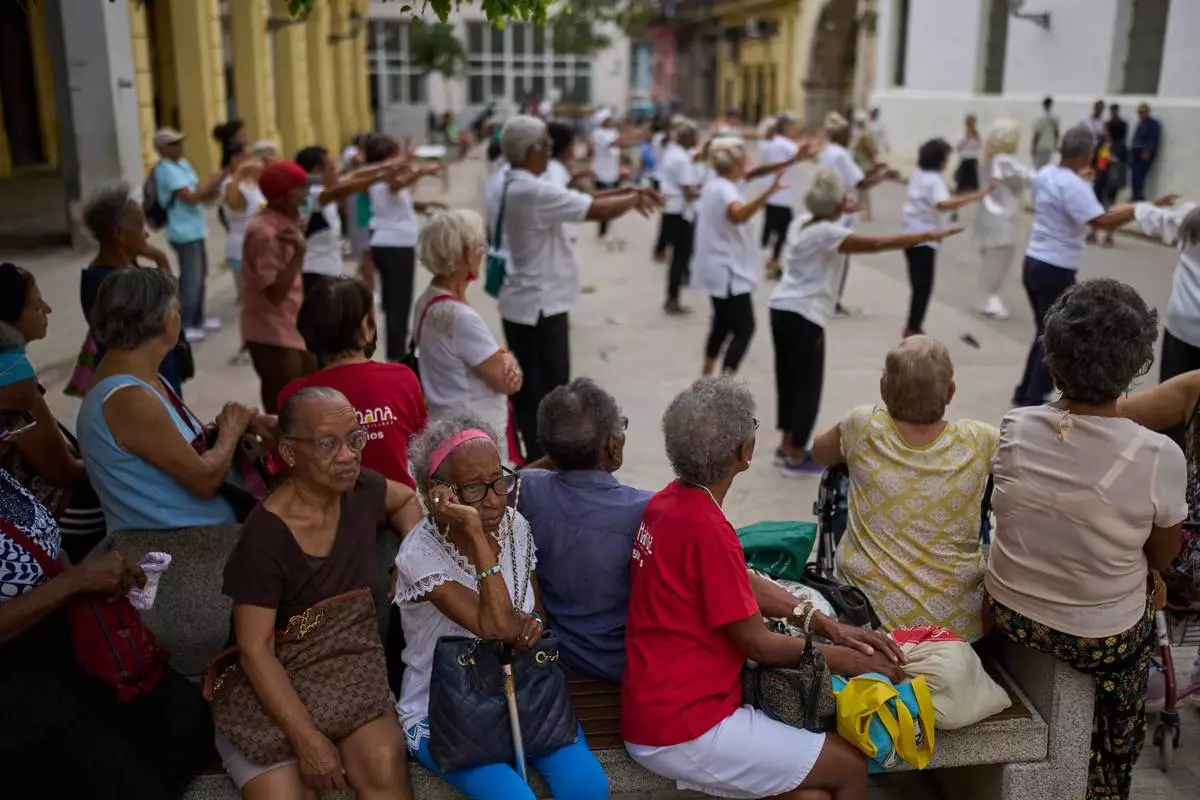FILE - Elderly residents watch a tai chi class for seniors at the Belen Convent in Old Havana, Cuba, Thursday, Feb. 20, 2025. (AP Photo/Ramon Espinosa, File)