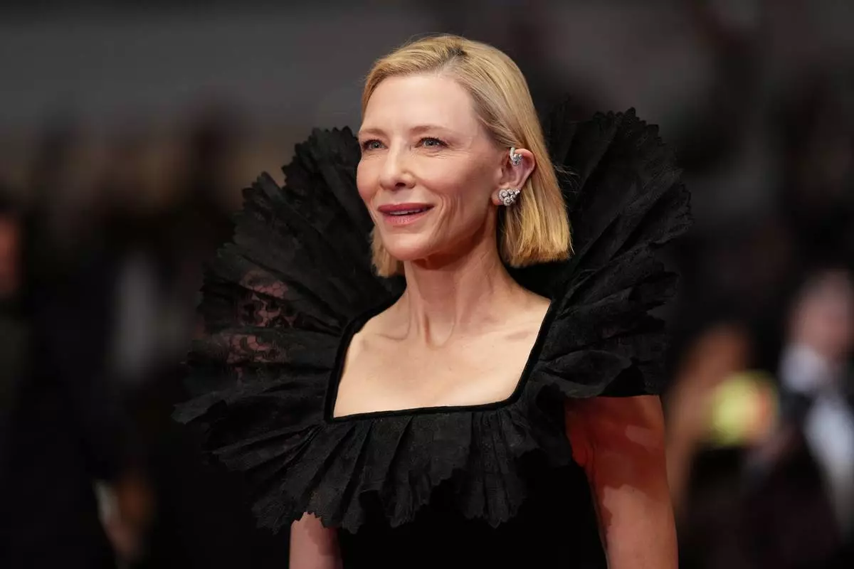 Cate Blanchett poses for photographers upon arrival at the premiere of the film 'Paper Tiger' at the 79th international film festival, Cannes, southern France, Saturday, May 16, 2026. (Photo by Scott A Garfitt/Invision/AP)