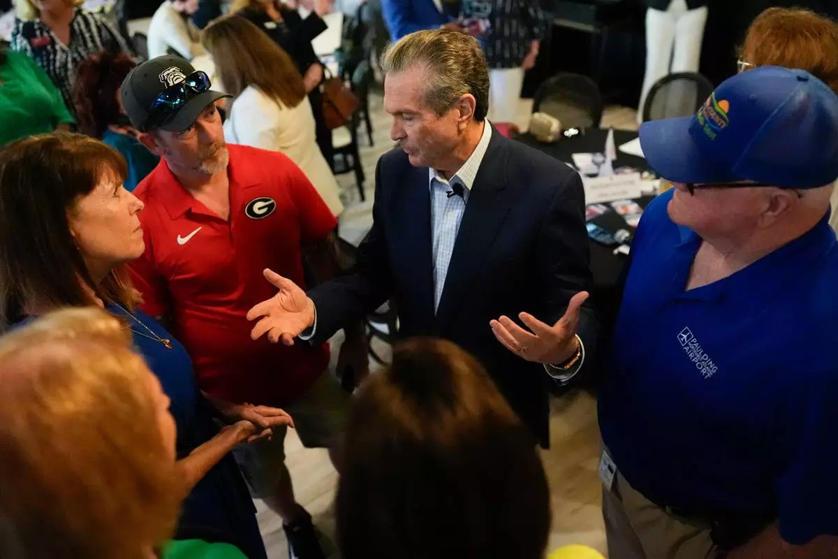 Republican gubernatorial candidate Rick Jackson speaks to voters during a campaign stop, Wednesday, May 13, 2026, in Hiram, Ga. (AP Photo/Mike Stewart)