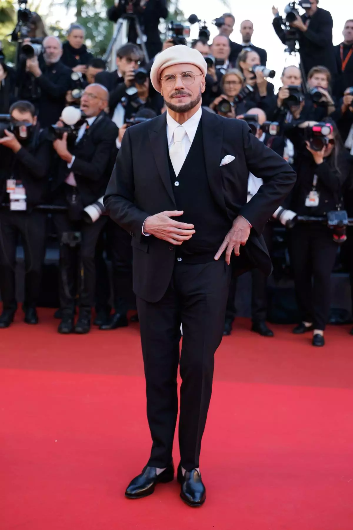 John Travolta poses for photographers upon arrival at the premiere of the film 'Karma' at the 79th international film festival, Cannes, southern France, Friday, May 15, 2026. (Photo by Millie Turner/Invision/AP)