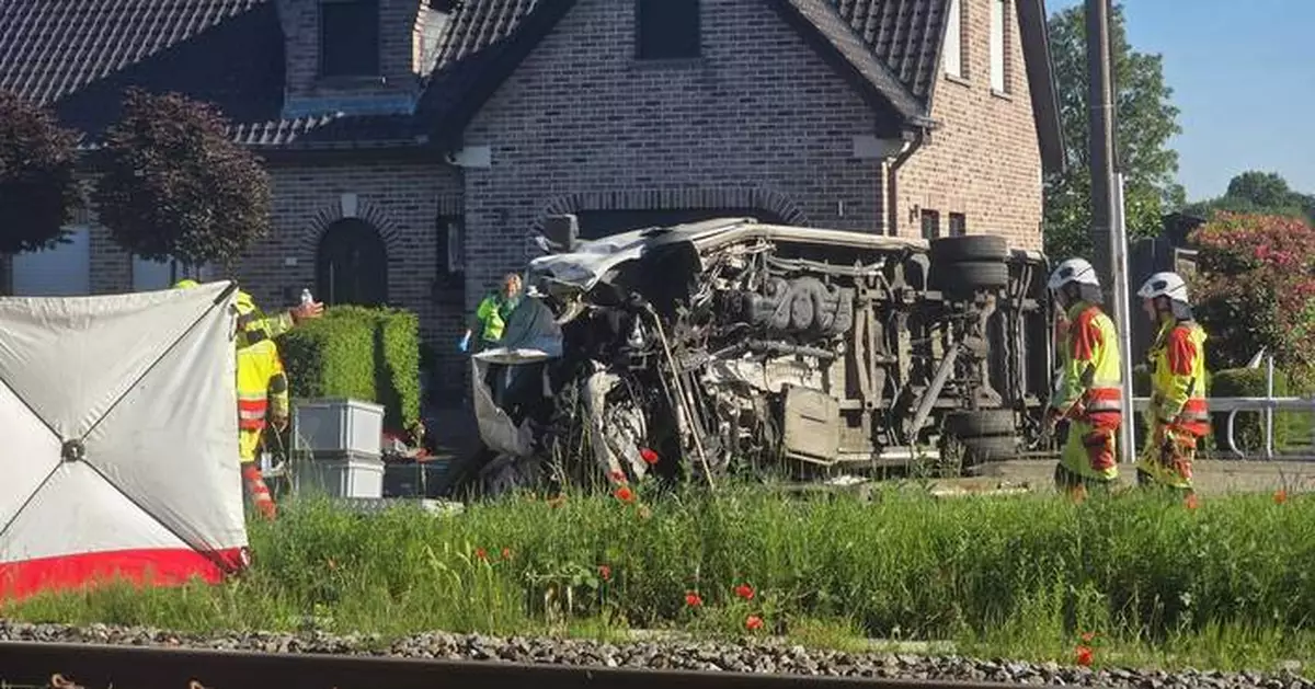 4 dead, 5 hurt in a crash between a train and a school bus, Belgian officials say