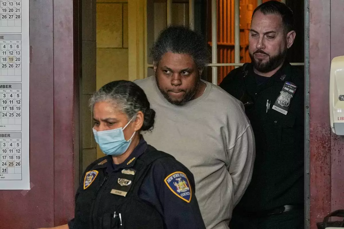 Randy Santos enters court for sentencing for fatally beating four sleeping men on the streets in 2019, in New York, Thursday, May 28, 2026. (AP Photo/Richard Drew)