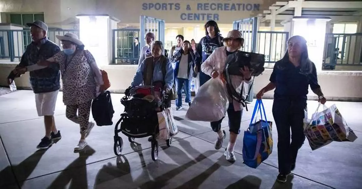 Evacuation centers fill up in southern California as efforts continue to cool damaged chemical tank