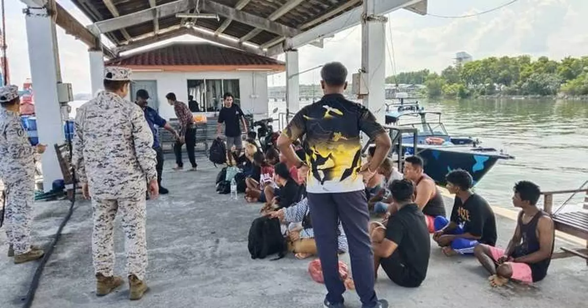 Malaysia searches for 14 missing Indonesians after a migrant boat sinks