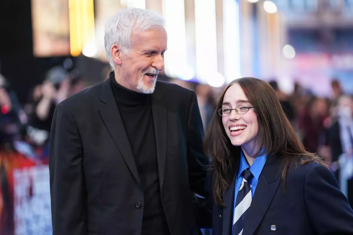James Cameron, left, and Billie Eilish pose for photographers upon arrival a the screening of the film 'Hit me Hard and Soft: The Tour' on Tuesday, April 28, 2026, in London. (Photo by Scott A Garfitt/Invision/AP)