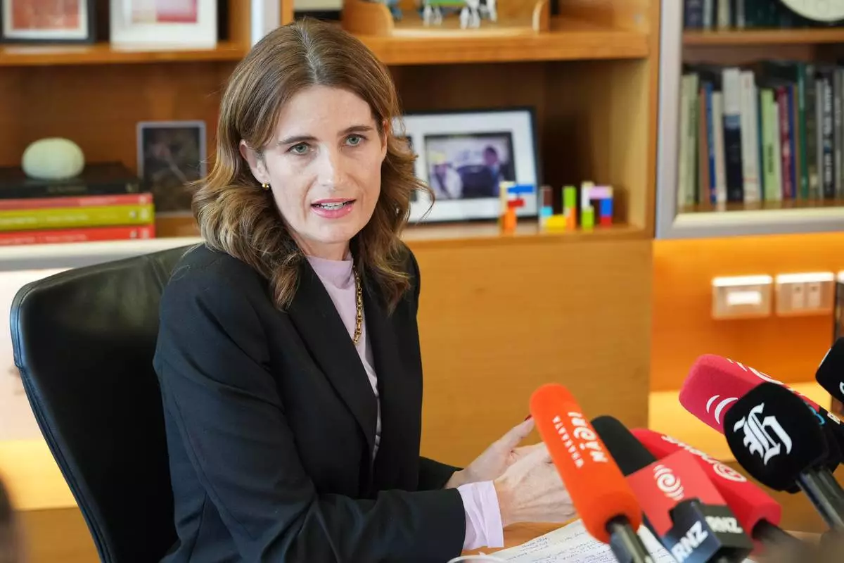 FILE - New Zealand Finance Minister, Nicola Willis, holds a press conference in her office at Parliament in Wellington, New Zealand, March 16, 2026. (AP Photo/Charlotte Graham-McLay, File)
