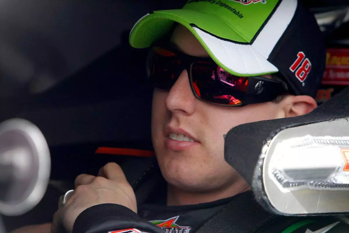 FILE - Driver Kyle Busch sits in his car prior to qualifying for the upcoming NASCAR Nationwide Series car race at Phoenix International Raceway Saturday, Feb. 26, 2011, in Avondale, Ariz. (AP Photo/Ross D. Franklin, File)