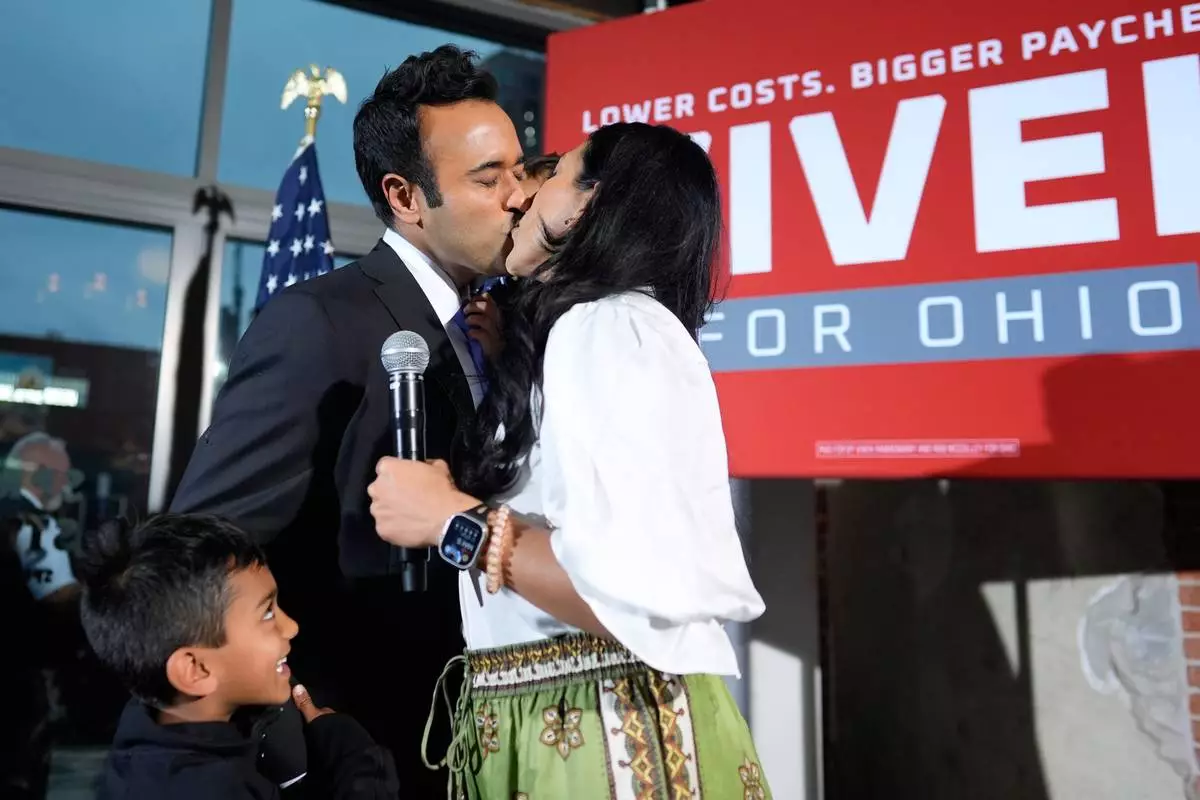 Republican Ohio gubernatorial candidate Vivek Ramaswamy kisses his wife Apoorva Ramaswamy during a watch party at the Spruce St. Sporting sports bar after winning the party?s nomination for governor Tuesday, May 5, 2026, in Columbus. (AP Photo/Carolyn Kaster)