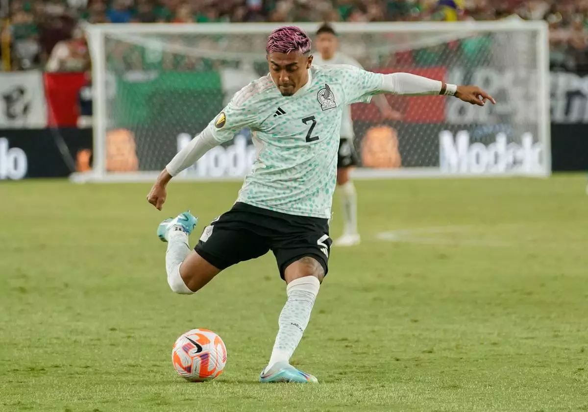 FILE _ Mexico's Julian Araujo (2) plays the ball during the first half of a CONCACAF Gold Cup soccer match against Haiti Thursday, June 29, 2023, in Glendale, Ariz. (AP Photo/Darryl Webb, File)