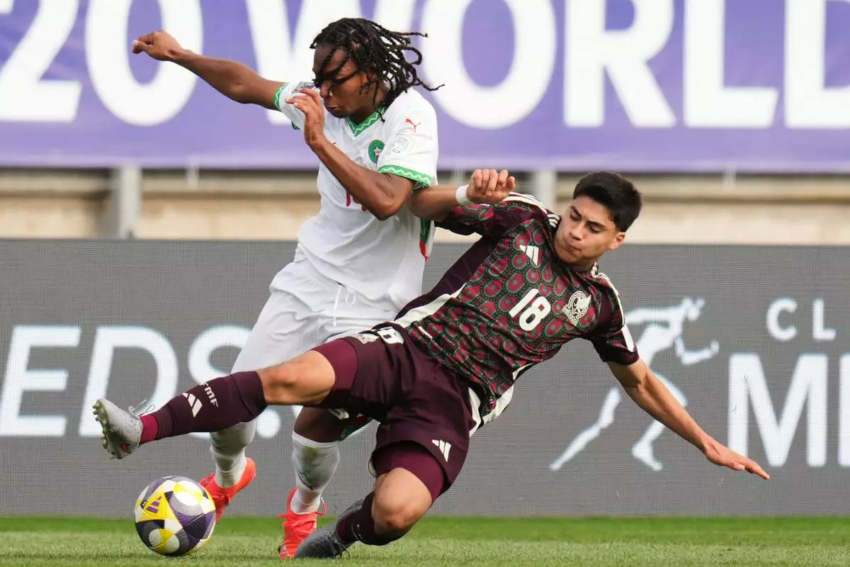 FILE - Mexico's Obed Vargas, right, and Morocco's Mohamed Hamony battle for the ball during a FIFA U-20 World Cup Group C soccer match at Elias Figueroa Brander Stadium in Valparaiso, Chile, Saturday, Oct. 4, 2025. (AP Photo/Andre Penner, File)