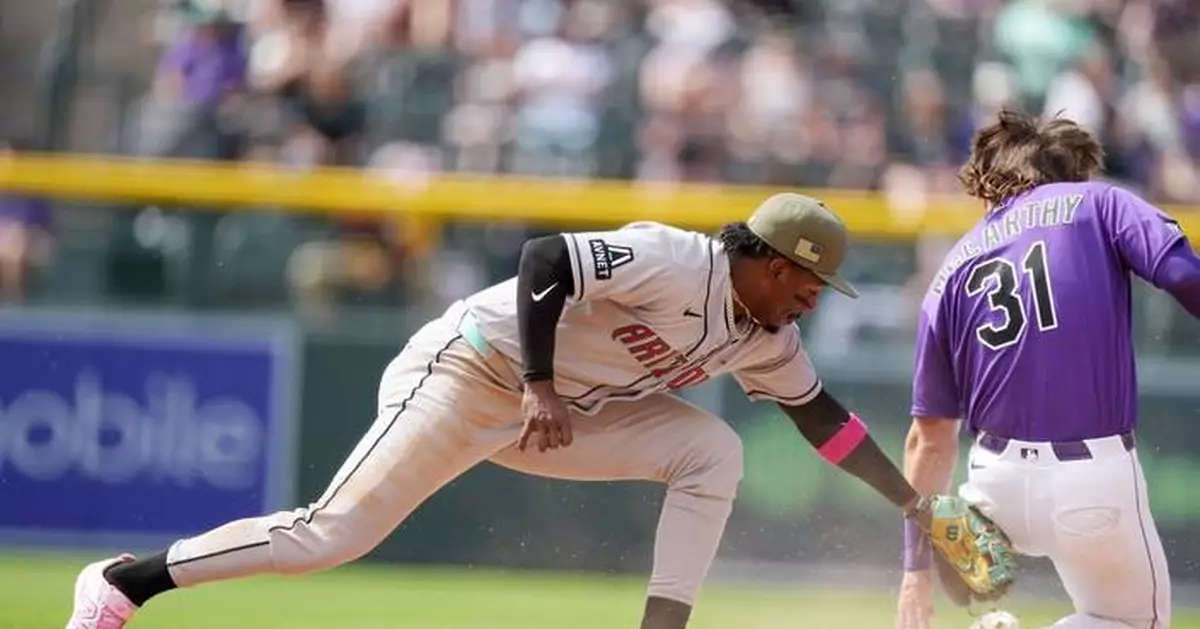 McCarthy singles twice and has an RBI against former team, helping Rockies beat Diamondbacks 4-2