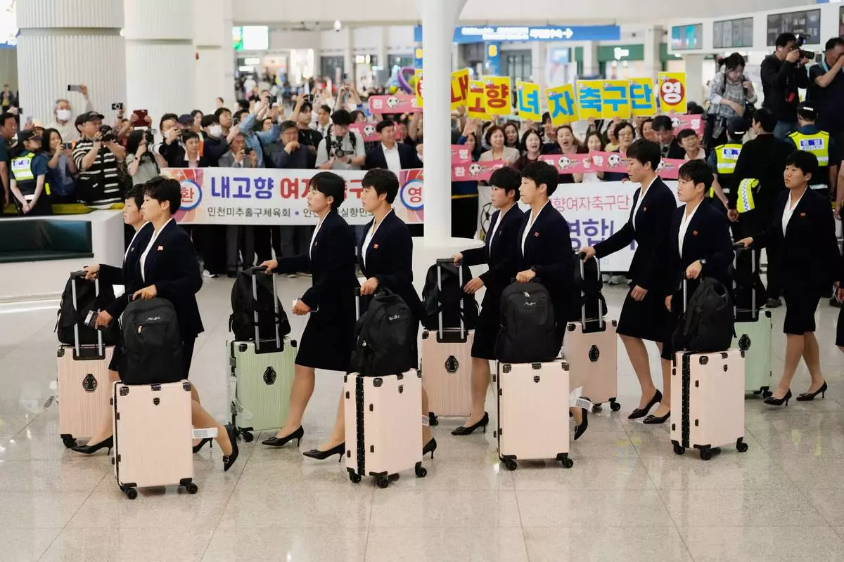 Members of North Korea's soccer club Naegohyang Women's FC team arrives at Incheon International Airpot in Incheon, South Korea, Sunday, May 17, 2026. (AP Photo/Ahn Young-joon)