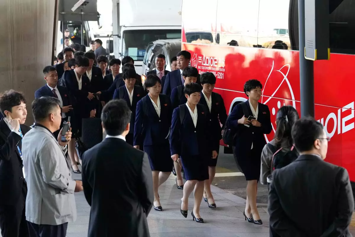 North Korean women's soccer players prepare to get into a bus after arriving for the semifinals of the AFC Women's Champions League at Incheon International Airpot in Incheon, South Korea Sunday, May 17, 2026. (AP Photo/Ahn Young-joon)