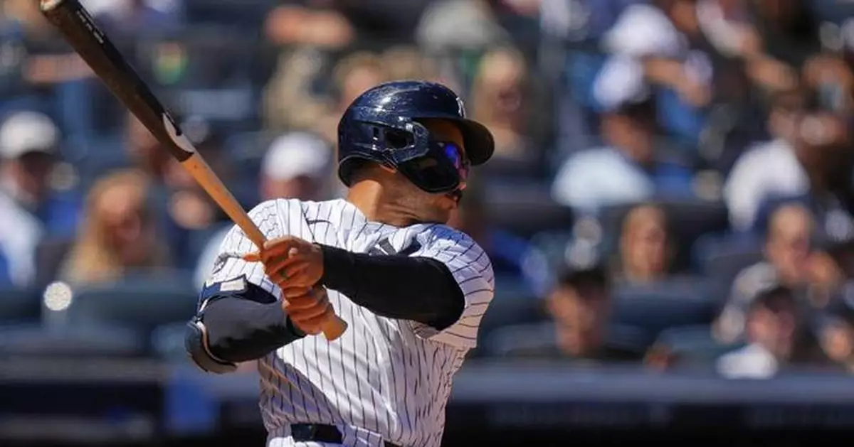 Grisham leads Yankees over Rangers 9-2 for 16th win in 19 games but Domínguez hurt hitting wall