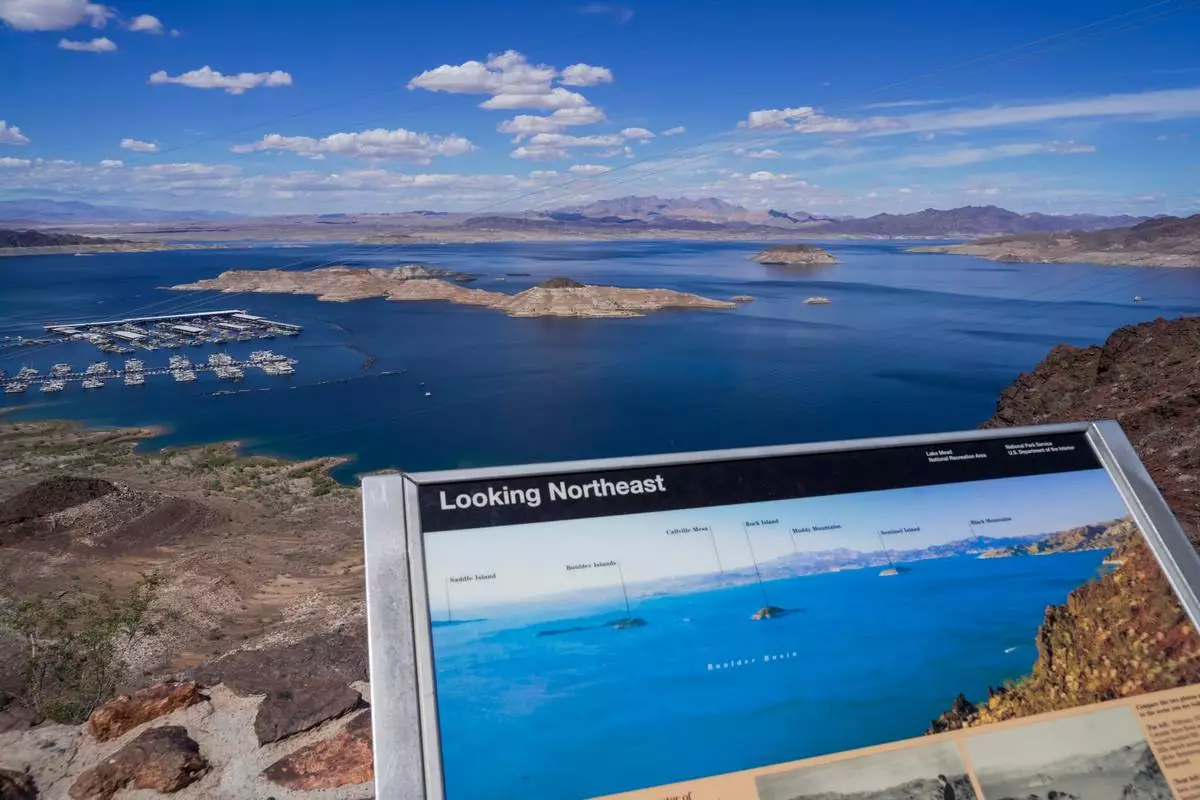 A informational map shows Lake Mead at a higher water level than is seen on Wednesday, Apr. 01, 2026, Boulder City, Nev. (AP Photo/Ty ONeil)