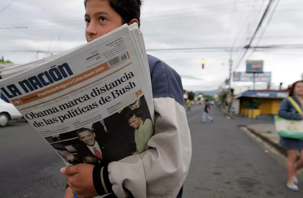 FILE - A vender sells La Nation newspapers in San Jose, Jan. 21, 2009. (AP Photo/Kent Gilbert, File)