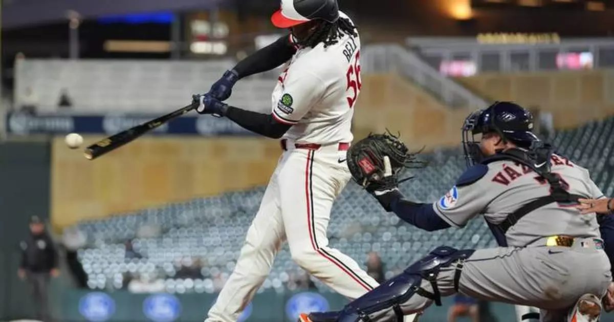 Josh Bell homers twice as Twins beat Astros 6-3 in game delayed nearly 2 hours by rain