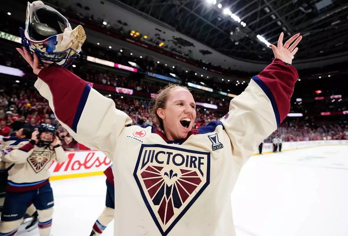 Montreal Victoire goaltender Ann-Renee Desbiens (35) celebrates after defeating the Ottawa Charge in game 4 of the PWHL Walter Cup hockey final in Ottawa, on Wednesday, May 20, 2026. (Justin TangThe Canadian Press via AP) CORRECTION: name of photographer Justin Tang