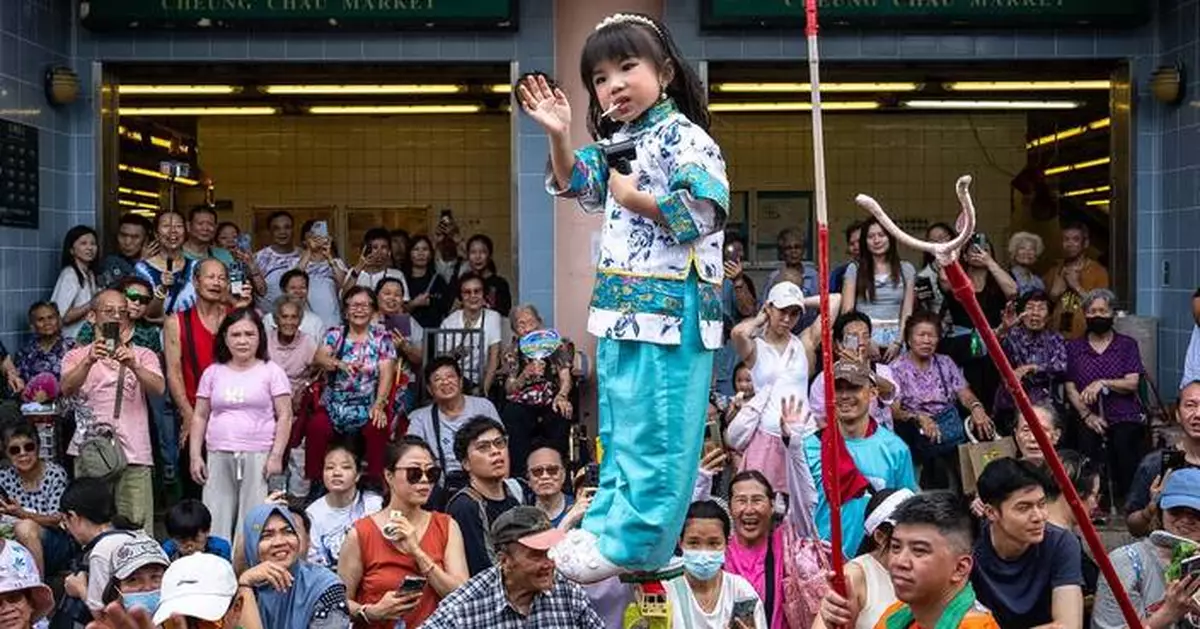 Revelers pack a Hong Kong island for a bun festival, a century-old tradition