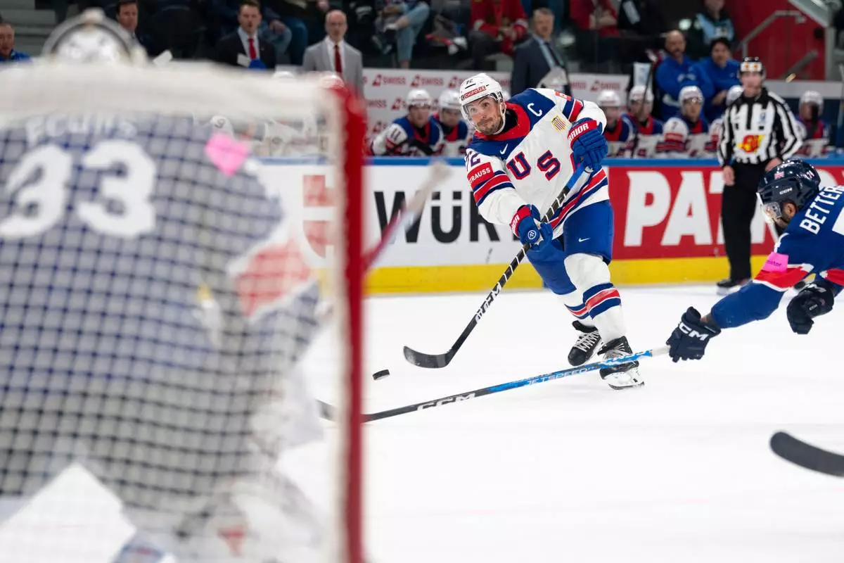 USA's Justin Faulk shoots the puck, during the 2026 IIHF Men's Ice Hockey World Championship preliminary round group A game between Britain and the United States, in Zurich, Switzerland, Sunday, May 17, 2026. (Claudio Thoma/Keystone via AP)
