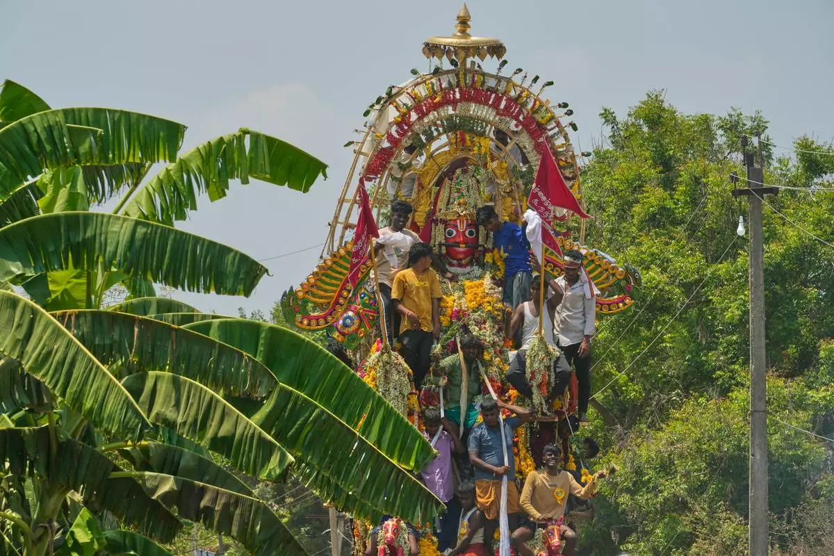 A chariot procession of the Hindu god Aravan is taken out during the Koovagam transgender festival in Kallakurichi district of the southern Indian state of Tamil Nadu, Wednesday, April 29, 2026. (AP Photo/Mahesh Kumar A.)