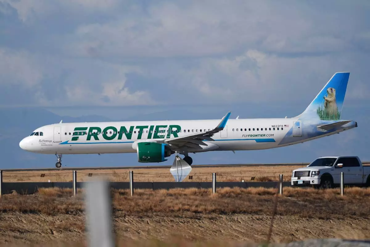 FILE - A Frontier Airlines jetliner taxis down a runway for take off from Denver International airport on Nov. 25, 2025, in Denver. (AP Photo/David Zalubowski, File)