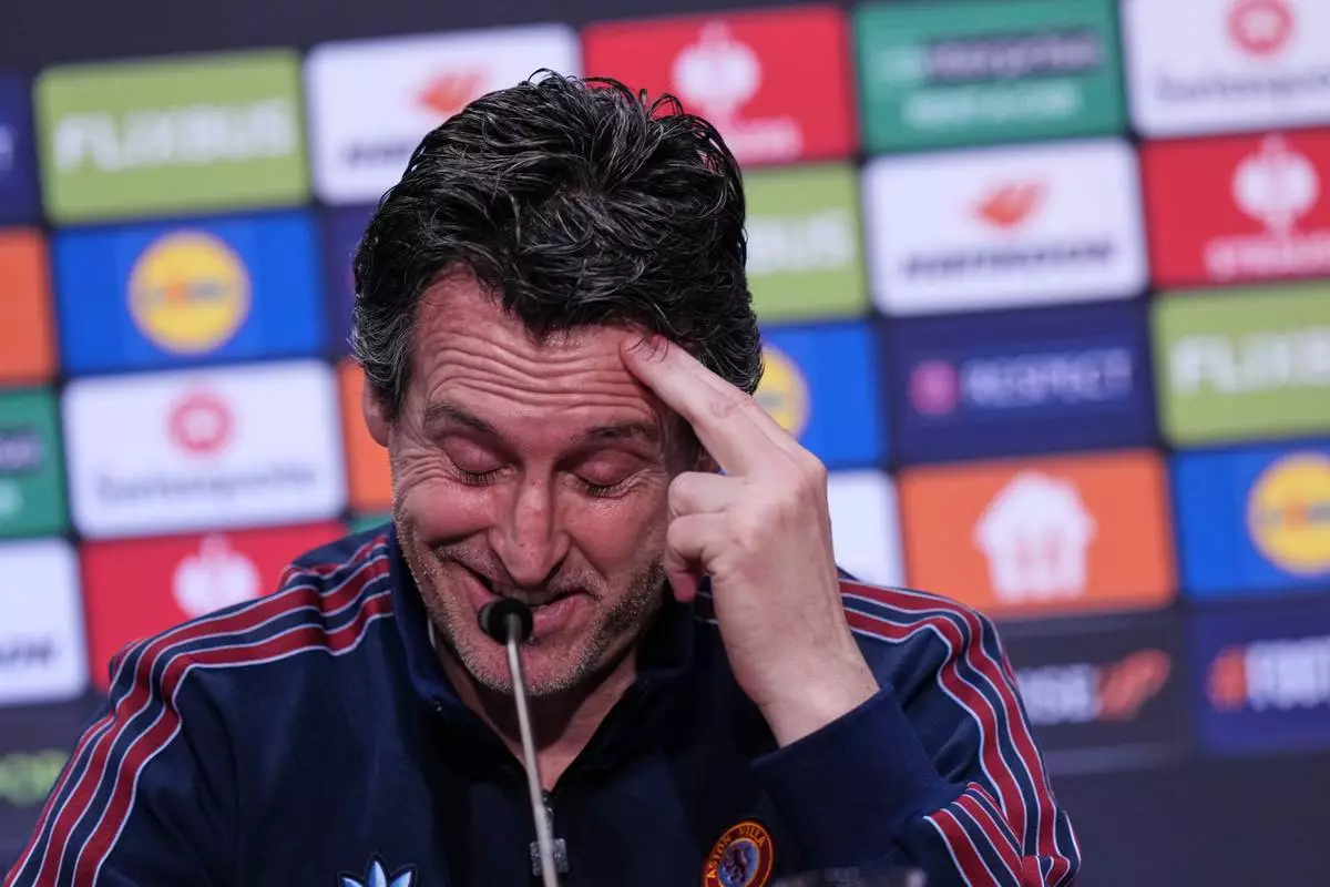 Aston Villa's head coach Unai Emery looks down during a press conference ahead of the Europa League final soccer match between Freiburg and Aston Villa in Istanbul, Turkey, Tuesday, May 19, 2026. (AP Photo/Francisco Seco, Pool)