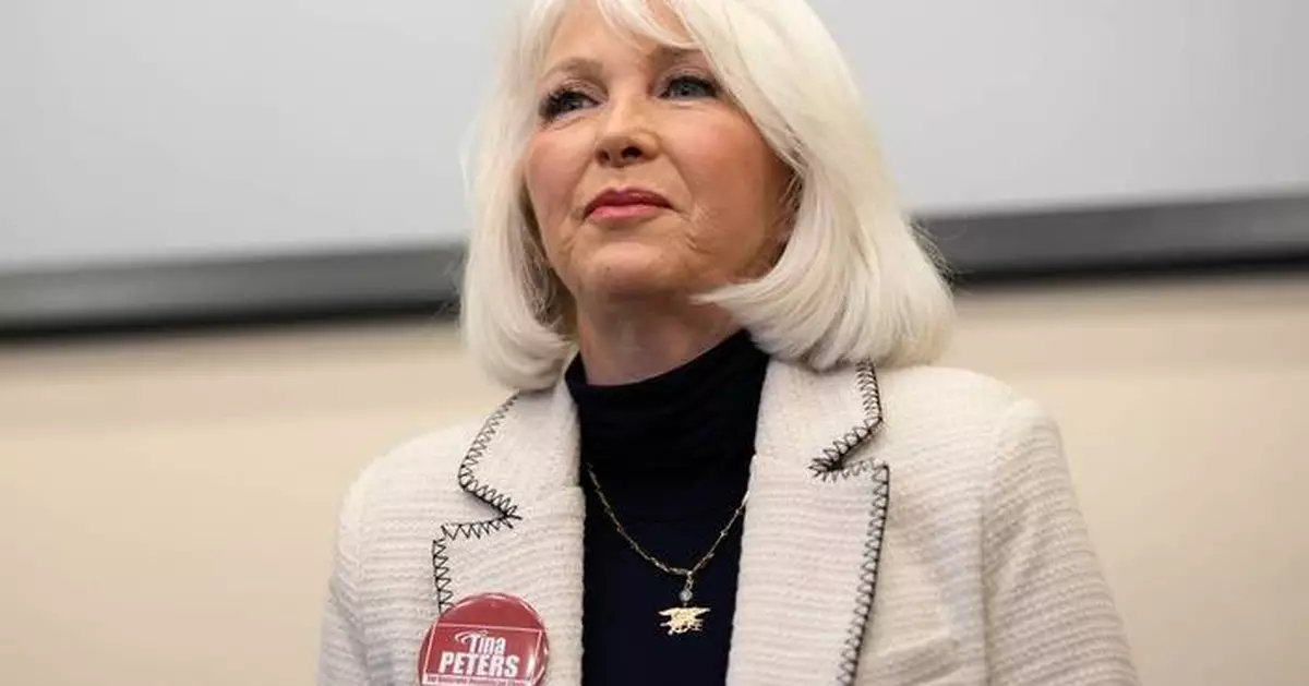 Colorado's Democratic governor commutes ex-election clerk Tina Peters' sentence after Trump pressure