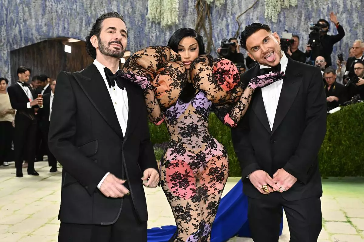 Marc Jacobs, from left, Cardi B and Char Defrancesco arrive at The Metropolitan Museum of Art's Costume Institute benefit gala celebrating the opening of the "Costume Art" exhibition on Monday, May 4, 2026, in New York. (Photo by Evan Agostini/Invision/AP)