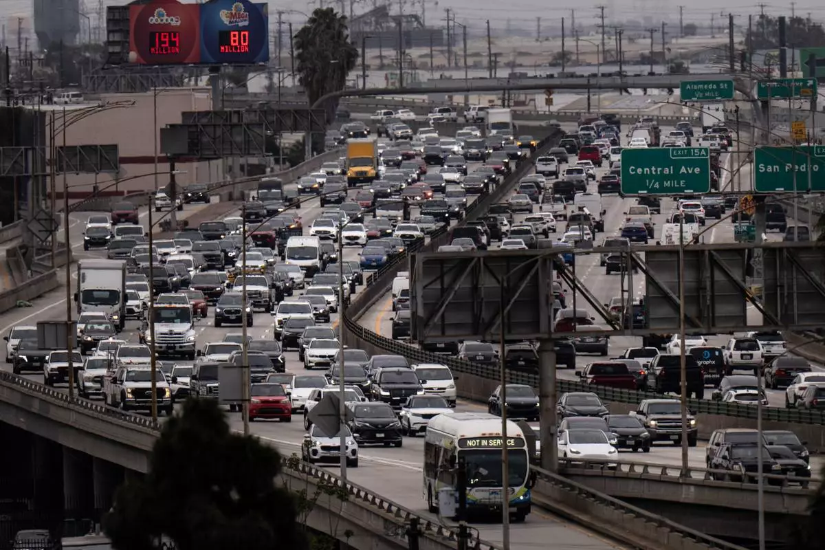 FILE - Traffic moves along the Interstate 10 freeway in Los Angeles, March 31, 2026. (AP Photo/Jae C. Hong, File)