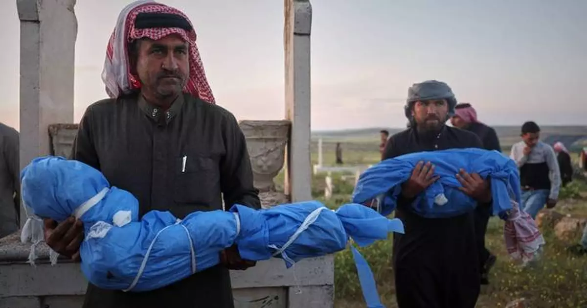 A grieving father buries his 6-year-old after a land mine kills 3 children in Syria's Idlib