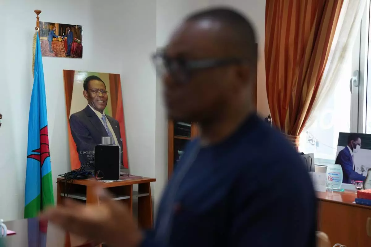 Framed portraits of Equatorial Guinea President, Teodoro Obiang Nguema Mbasogo, displayed in an office setting in Malabo, Equatorial Guinea, Friday, April 24, 2026. (AP Photo/Misper Apawu)