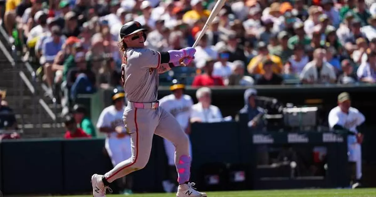 Bader's wind-aided grand slam helps Giants breeze to 10-1 victory over Athletics