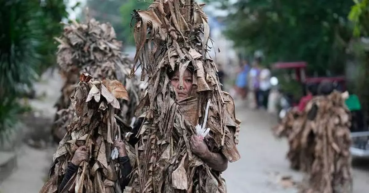 Philippine devotees honor St. John the Baptist with a mud-covered display of faith