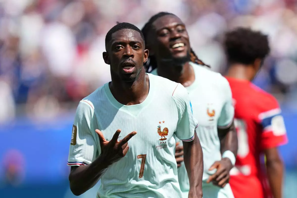 France's Ousmane Dembele celebrates after scoring his side's third goal during the World Cup Group I soccer match between Norway and France in Foxborough, Mass., near Boston, Friday, June 26, 2026. (AP Photo/Martin Meissner)