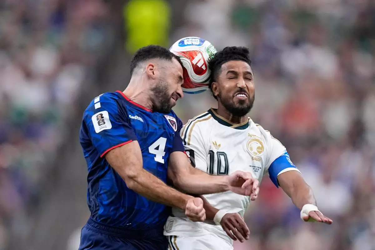 Saudi Arabia's Salem Aldawsari (10) battles for the ball with Cape Verde's Pico Lopes (4) during the World Cup Group H soccer match between Cape Verde and Saudi Arabia in Houston, Friday, June 26, 2026. (AP Photo/Ashley Landis)