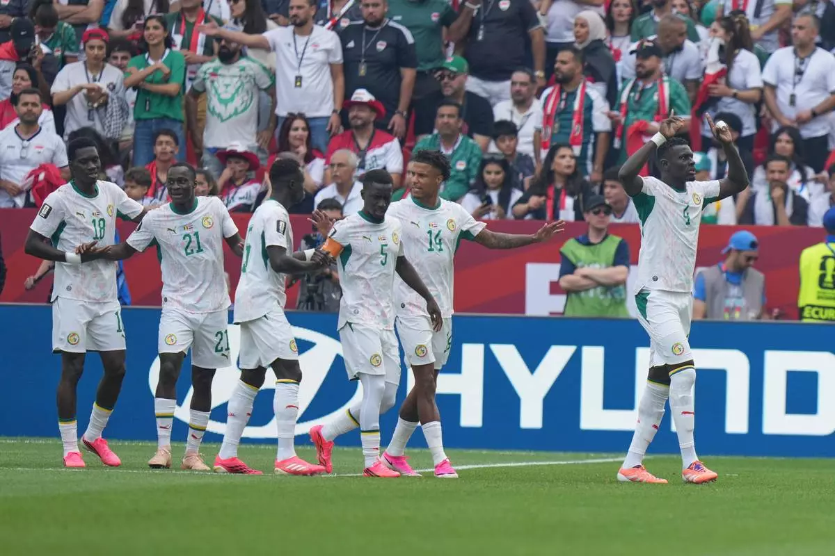 Senegal's Habib Diarra (21) celebrates scoring their first goal during the World Cup Group I soccer match between Senegal and Iraq in Toronto, Friday, June 26, 2026. (AP Photo/Stephanie Scarbrough) CORRECTION: Corrects goal scorer to Senegal's Habib Diarra (21), not Abdoulaye Seck.