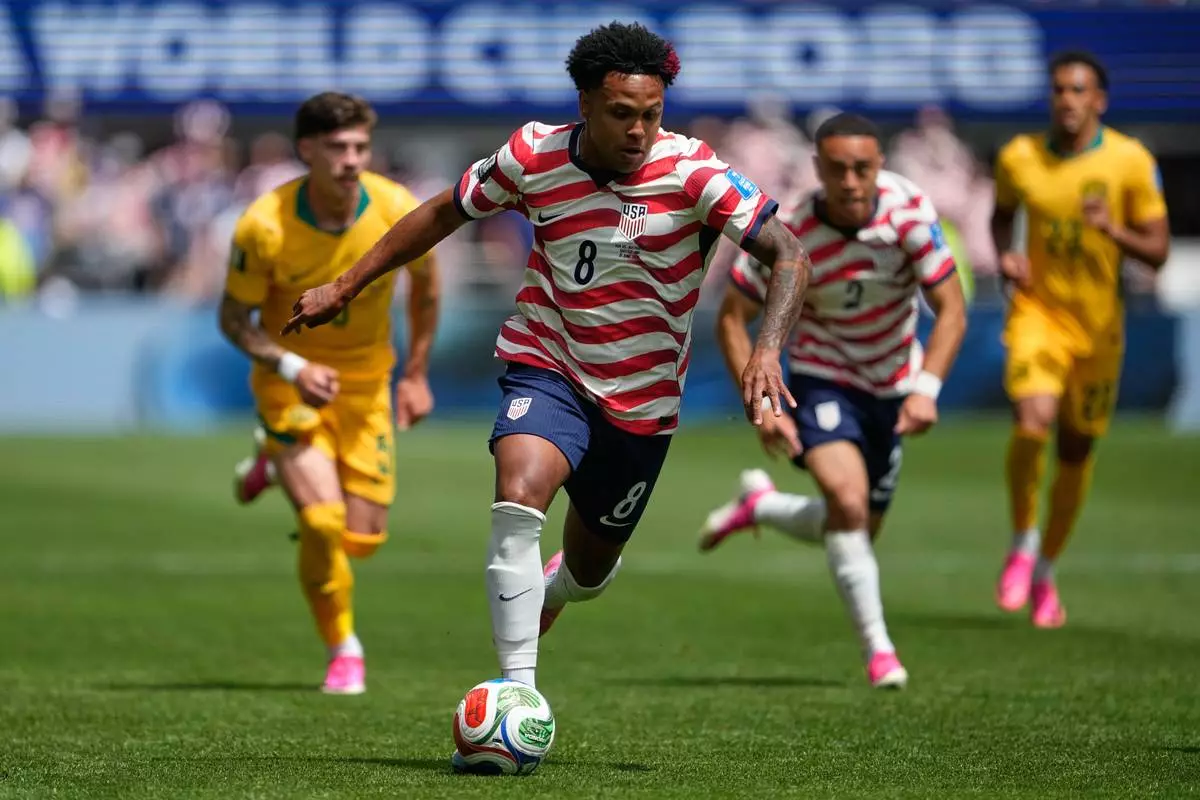 FILE - United States' Weston McKennie (8) moves the ball during the World Cup Group D soccer match between the United States and Australia in Seattle, Friday, June 19, 2026. (AP Photo/Lindsey Wasson, File)