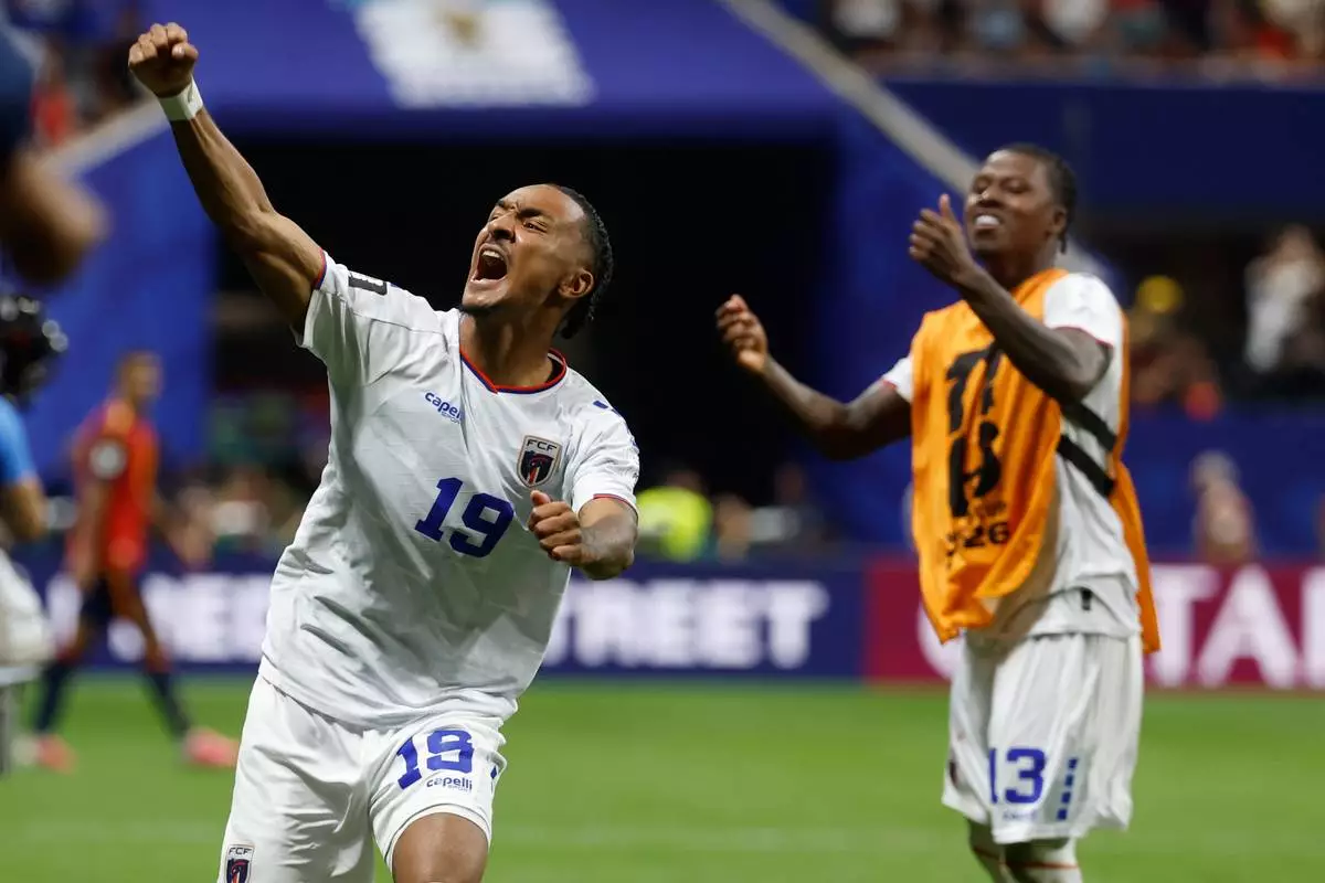 Cabo Verde's Dailon Livramento, left, and Cabo Verde's Sidny Lopes Cabral celebrate after the World Cup Group H soccer match between Spain and Cape Verde in Atlanta, Monday, June 15, 2026. (AP Photo/Erik S. Lesser)