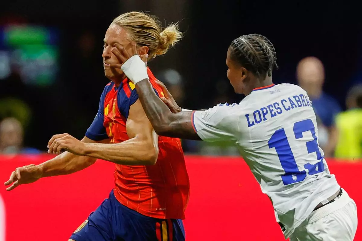 Cabo Verde's Sidny Lopes Cabral pushes Spain's Marcos Llorente during the World Cup Group H soccer match between Spain and Cape Verde in Atlanta, Monday, June 15, 2026. (AP Photo/Erik S. Lesser)