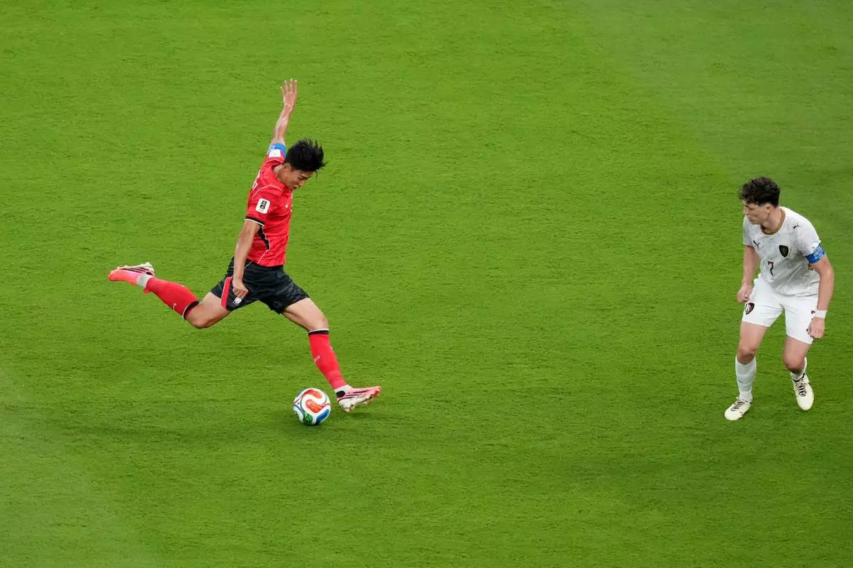 South Korea's Son Heung-min, left, shoots on goal against Czechia's Ladislav Krejci during the World Cup Group A soccer match between South Korea and Czechia in Zapopan, near Guadalajara, Mexico, Thursday, June 11, 2026. (AP Photo/Moises Castillo)
