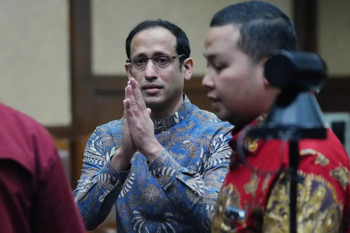 The co-founder of ride-hailing and payment giant Gojek and fomer Indonesian Education Minister Nadiem Anwar Makarim gestures after being sentenced in a Google Chromebook laptop procurement corruption case, at the Corruption Court in Jakarta, Indonesia, Tuesday, June 30, 2026. (AP Photo/Tatan Syuflana)
