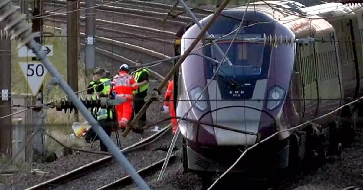 UK police probe cause of train collision that killed driver and left 9 in critical condition