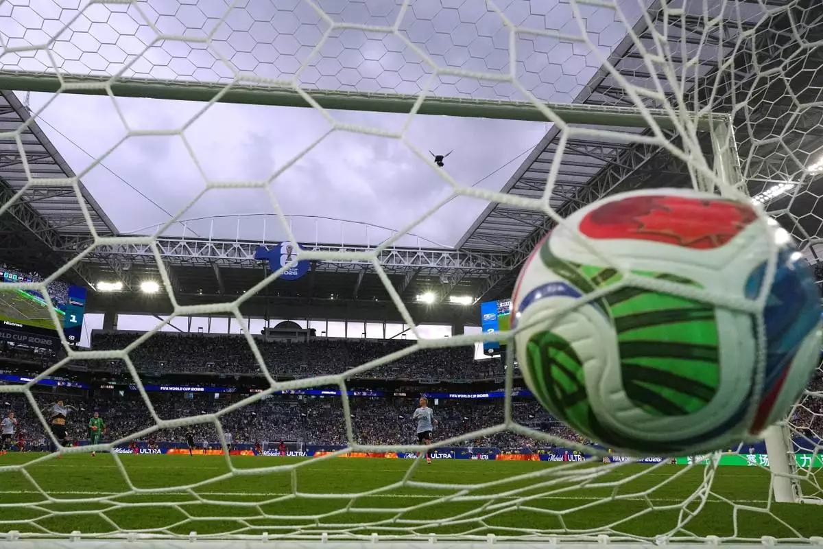 Cape Verde's Helio Varela (26) scores their second goal during the World Cup Group H soccer match between Uruguay and Cape Verde in Miami Gardens, Fla., Sunday, June 21, 2026. (AP Photo/Lynne Sladky) CORRECTION - Corrects match, teams and location.