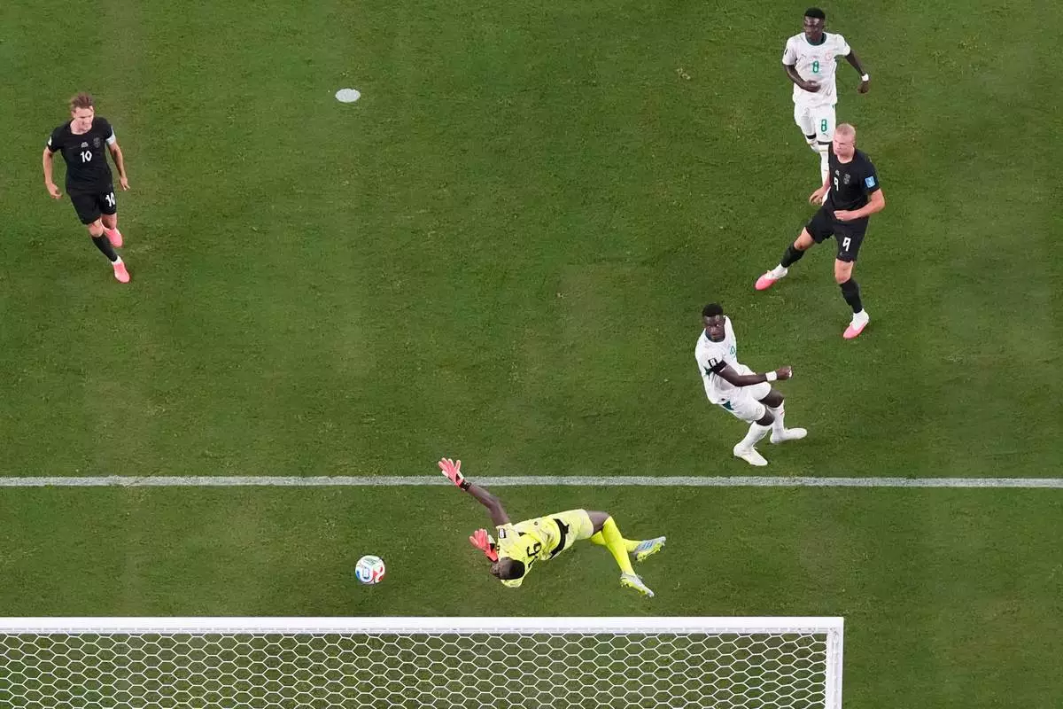 Norway's Erling Haaland (9) scores their third goal during the World Cup Group I soccer match between Norway and Senegal in East Rutherford, N.J., near New York, Monday, June 22, 2026. (AP Photo/Stephen Collingwood)